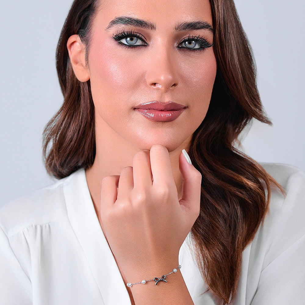 BRACCIALE DONNA IN ACCIAIO PERLE SINTETICHE E FIOCCO