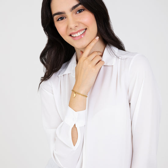 BRACELET FEMME EN ACIER PLAQUÉ OR AVEC AILE