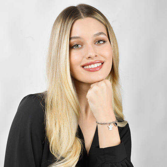 BRACELET FEMME EN ACIER AVEC BRELOQUE ANGE ET COEUR