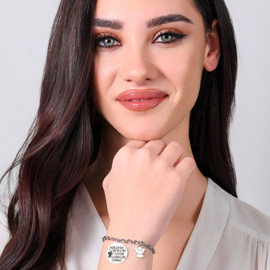 BRACELET FEMME EN ACIER AVEC BRELOQUE ANGE