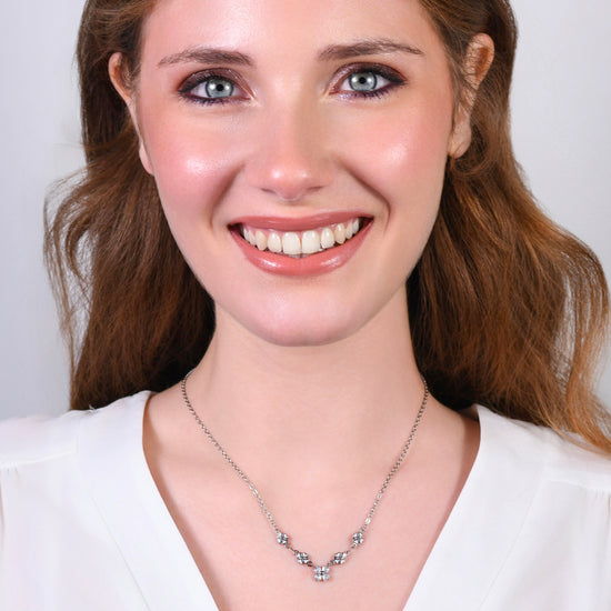 COLLANA IN ACCIAO CON QUADRIFOGLI E ZIRCONI BIANCHI