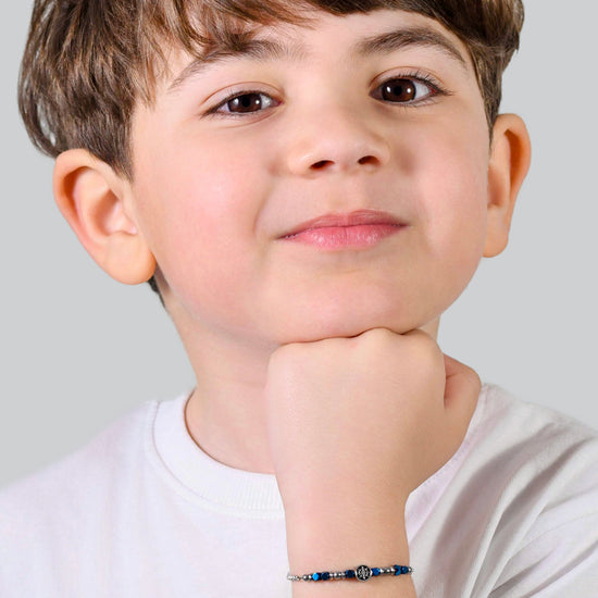 BRACCIALE BAMBINO IN ACCIAIO CON EMATITE BLU E TIMONE Luca Barra