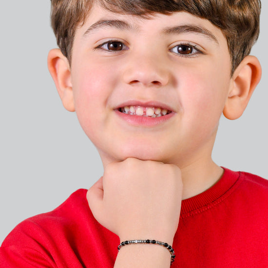 BRACELET BÉBÉ EN ACIER AVEC PIERRES NOIRES ET GRISES