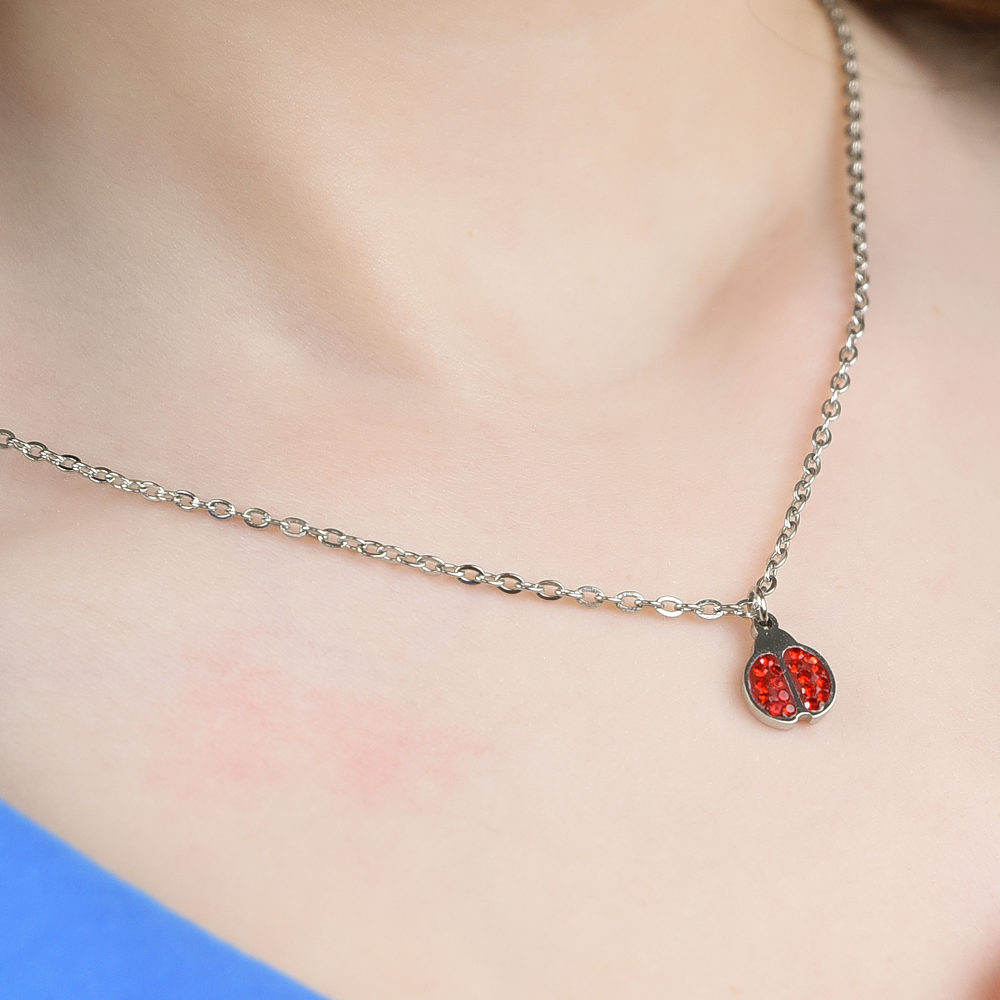 COLLIER D'ENFANT EN ACIER AVEC COCCINELLE ET CRISTAUX ROUGES Luca Barra