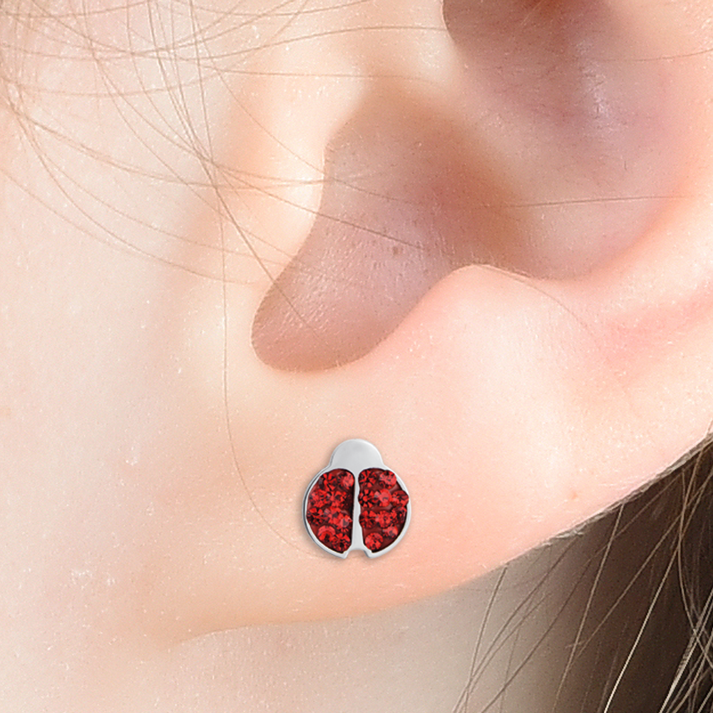 BOUCLE D'OREILLE D'ENFANT EN ACIER AVEC DES CRISTAUX ROUGES ET DE LA CHERCOLATE Luca Barra